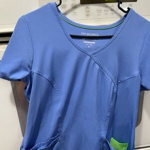 Healing hands scrub top size medium ceil blue color, barely worn